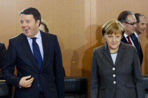 German Chancellor Angela Merkel, right, arrives with Prime Minister of Italy Matteo Renzi, left, for the German and Italian government consultations at the chancellery in Berlin, Monday, March 17, 2014. (AP Photo/Markus Schreiber).